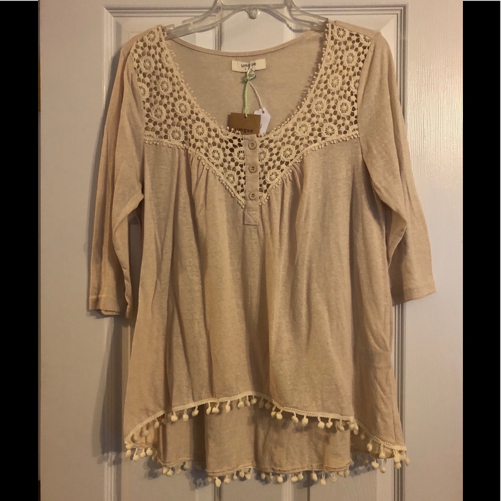 Tan color blouse with tassels.